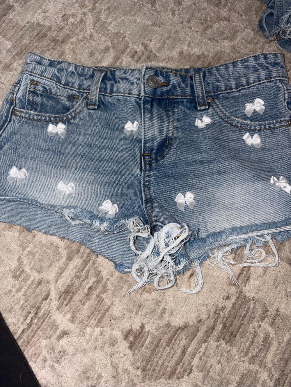 RSQ Light Blue Denim Short Shorts with White Bow Appliqués